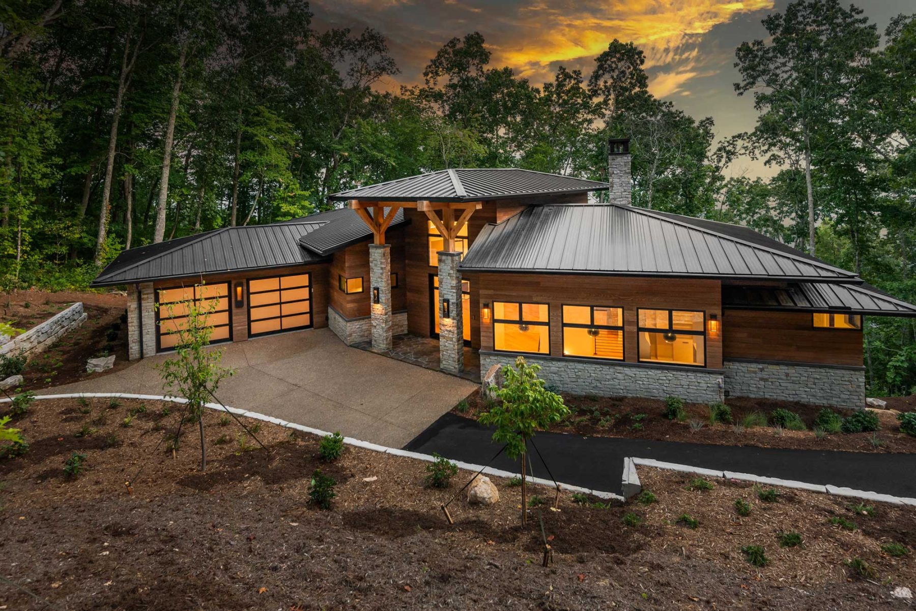 Southcliff Custom Home Builder - A stunning two-story deck perfectly captures the views from this Modern Prairie-style home sitting at a 3,850 ft elevation. The home is situated perfectly on the site, ensuring spectacular views from every room by Osada Construction
