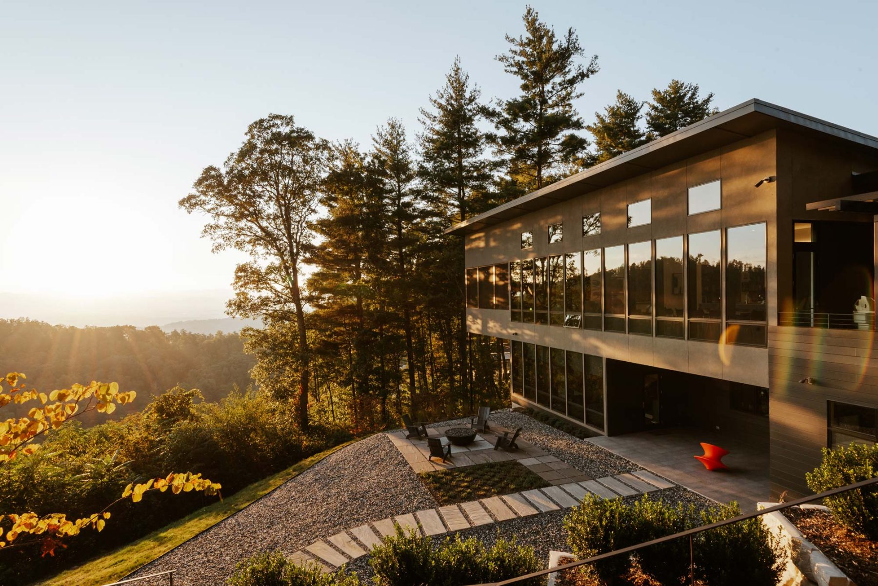 Home Builder Asheville. The blend of ultra-contemporary features sleek, monochromatic finishes with window wall for stunning city views by Osada Construction.