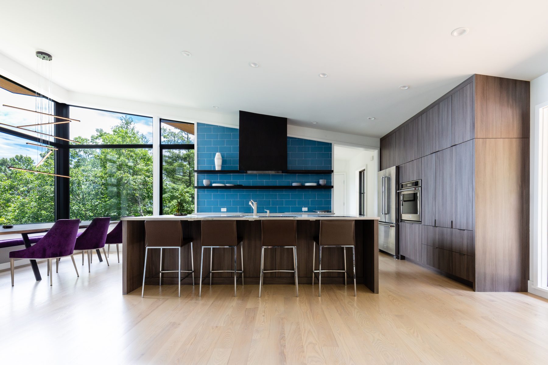 Modern Mountain Custom Builders Asheville. The cantilevered architecture of this home creates the impression of living amidst the trees by Osada Construction.