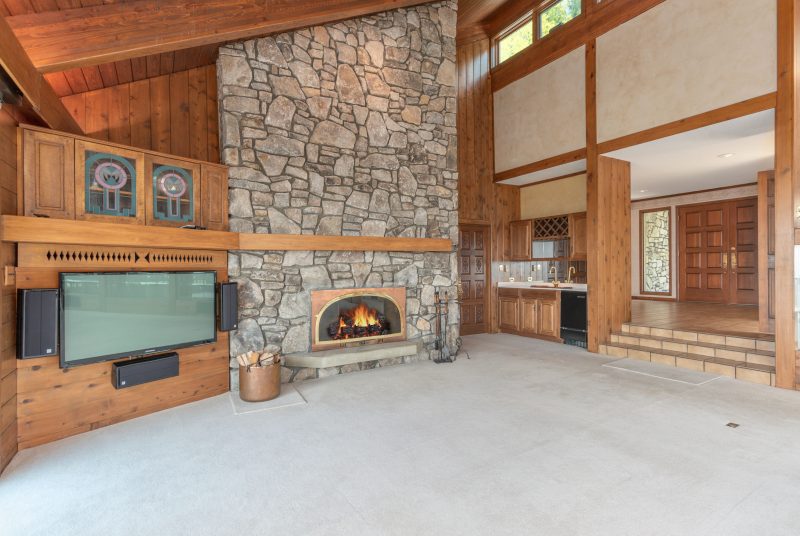 Asheville Midcentury Renovation - before fireplace built-ins by Osada Construction