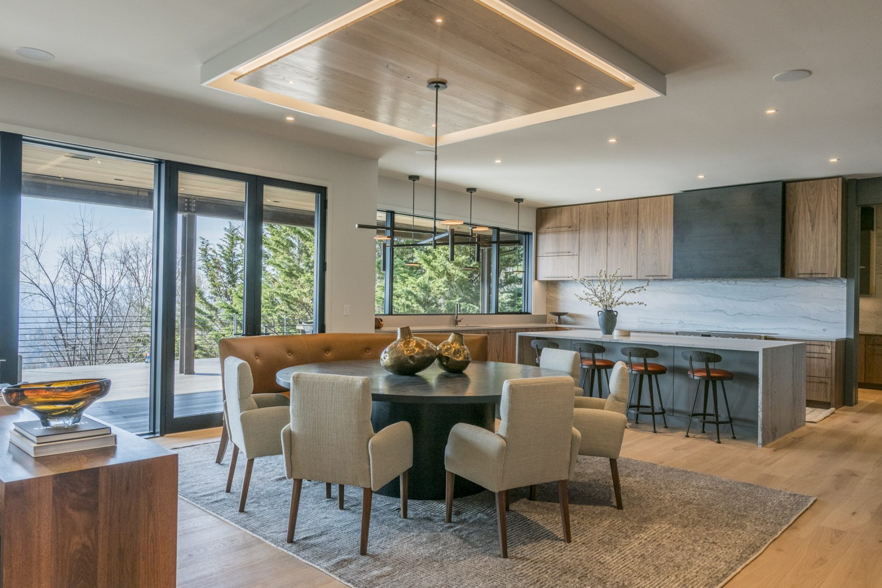 Modern Asheville Renovation after kitchen and dining space by Osada Construction