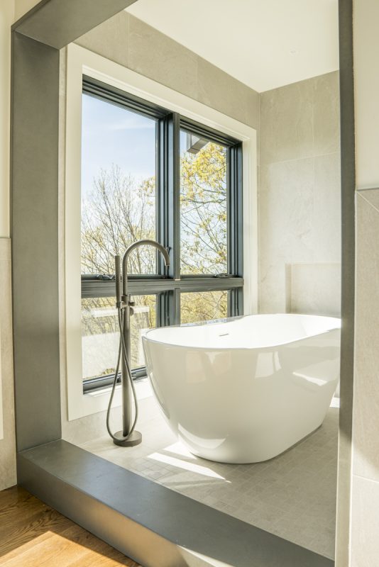Asheville Midcentury Renovation - after owners tub by Osada Construction