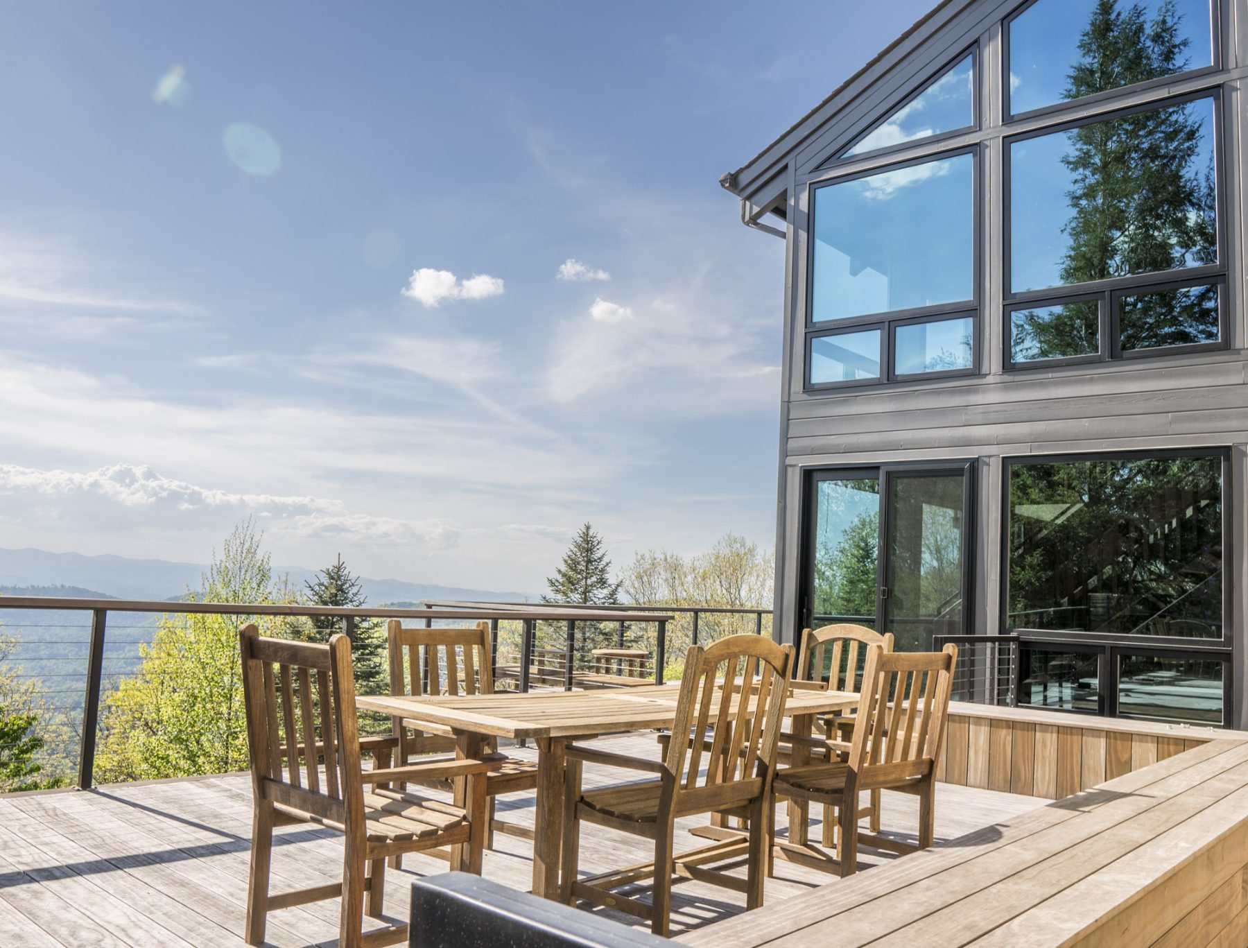 Asheville Midcentury Renovation - after deck addition by Osada Construction