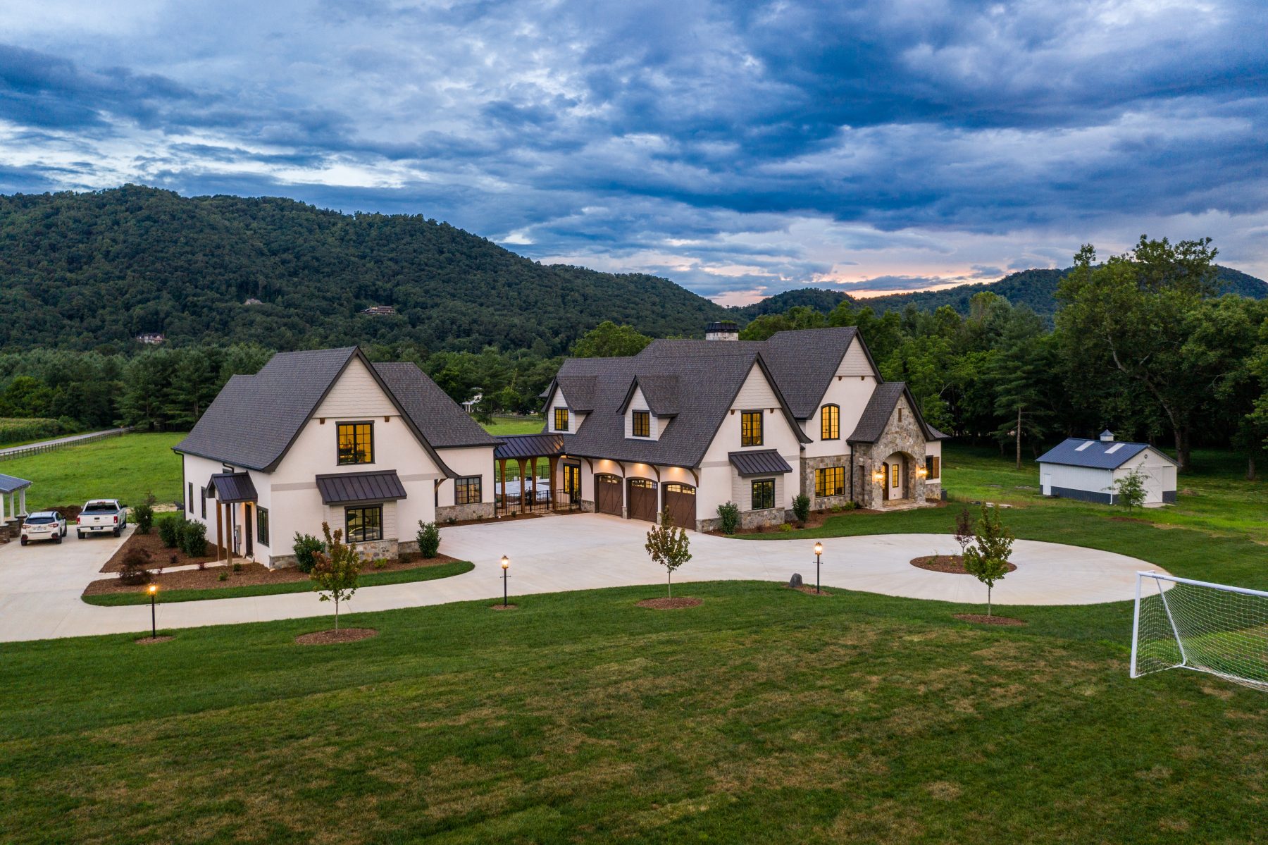 Asheville Mountain Valley Estate exterior sunset by Osada Construction