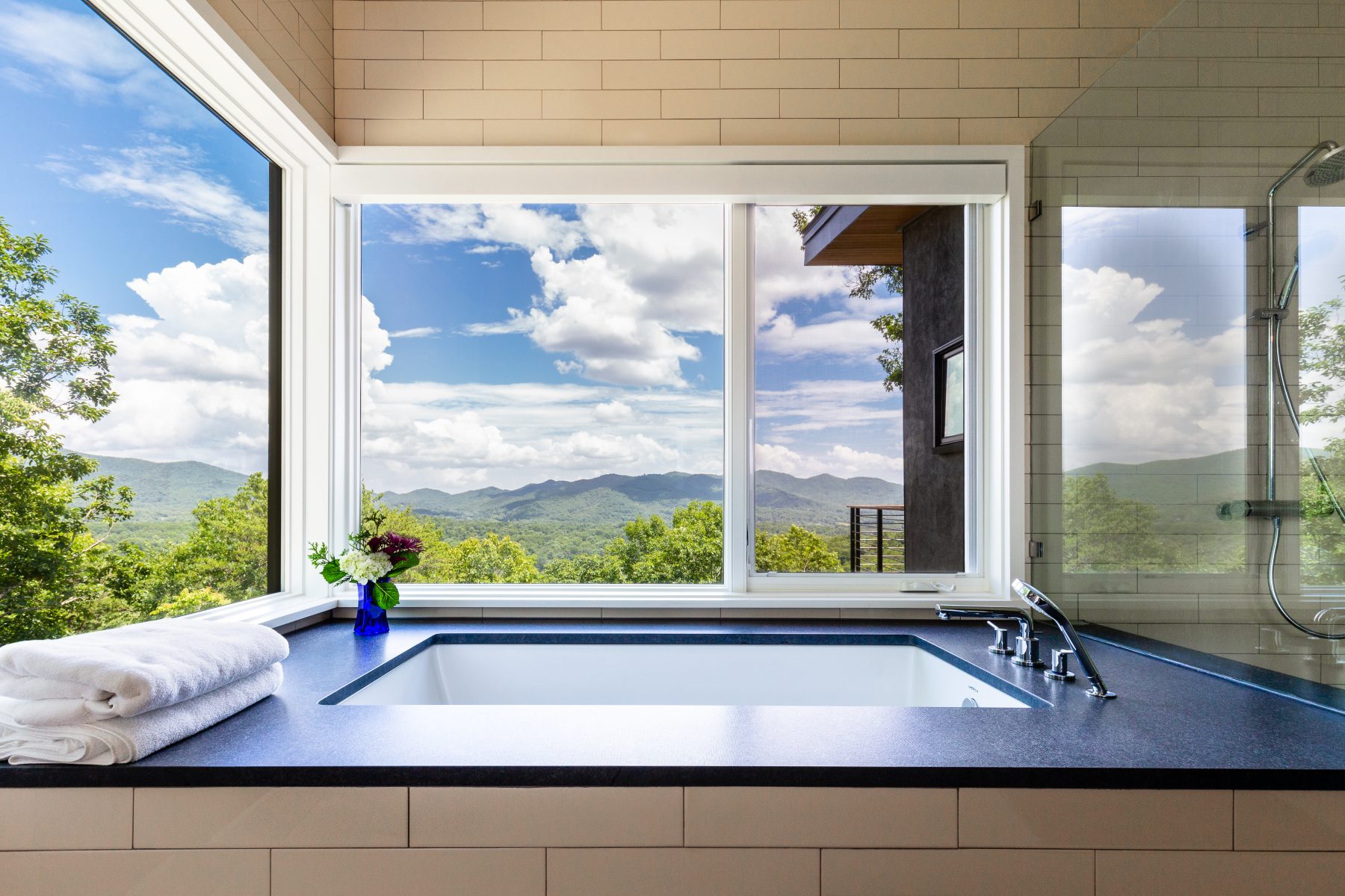 Modern Mountain Custom Builders Asheville- bath tub views by Osada Construction